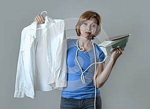 Woman or housewife sad bored and stressed holding white shirt an