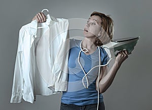 Woman or housewife sad bored and stressed holding white shirt an