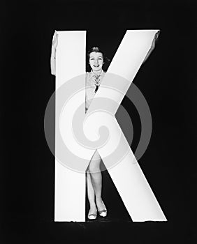 Woman with huge letter K