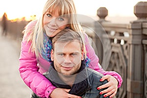 Woman is hugging her boyfriend in winter