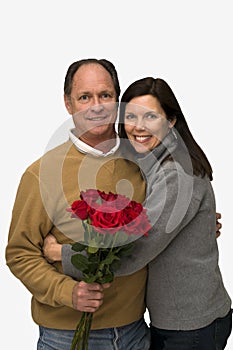 Woman Hugging Man With Red Roses