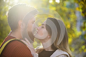 Woman hugs man with beard with tenderness, close up