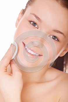 Woman hydrates face skin photo