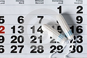 Woman hygiene protection , calendar close up.menstruation with cotton swabs used