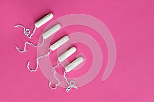 Woman hygiene protection, Ñotton tampons on pink background