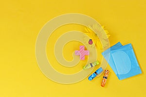 Woman hygienic protection, menstruation, cotton swabs, sanitary pads on a yellow background. critical days. Copy space