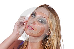 Woman with ice cube on her cheek