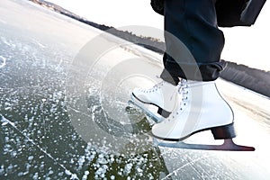 Woman ice skates with overview