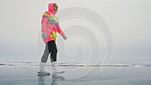 Woman on ice in winter is do sport in athletic race walking. Girl is training in winter on ice. Sports nordic power