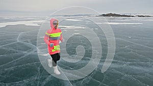 Woman on ice in winter is do sport in athletic race walking. Girl is training in winter on ice. Sports nordic power