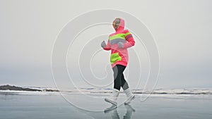 Woman on ice in winter is do sport in athletic race walking. Girl is training in winter on ice. Sports nordic power