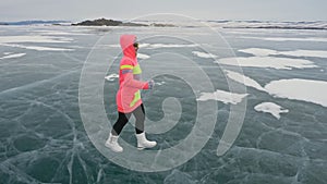 Woman on ice in winter is do sport in athletic race walking. Girl is training in winter on ice. Sports nordic power