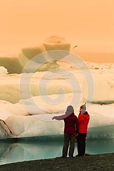 Woman in Iceberg lagoon jokulsarlon on the south of Iceland. Toned