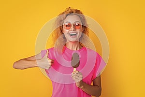 woman with icelolly ice cream in studio, thumb up. woman with icelolly ice cream photo