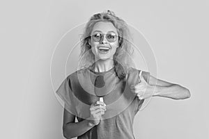 woman with icelolly ice cream in studio, thumb up. woman with icelolly ice cream photo