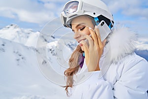 Woman idle talk on the mobile phone in the high mountains