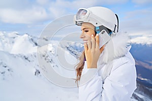 Woman idle talk on the mobile phone in the high mountains