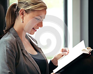Woman immersed in a book photo