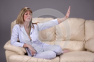 Woman indicating with hand the concept of stay away