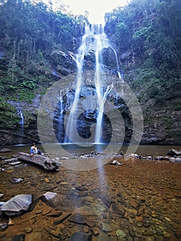 A woman in Indio Waterfall, Rio Acima, Minas Gerais, Brazil. photo