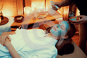 Woman indulges in rejuvenating with luxurious face cream spa massage. Quiescent