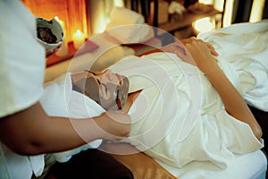 Woman indulges in rejuvenating with luxurious face cream spa massage. Quiescent