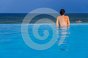 Woman in the infinity pool