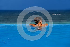 Woman in the infinity pool