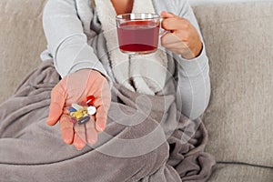 Woman with influenza on the sofa