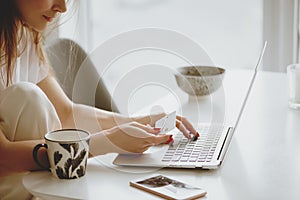 Woman inputting card information while shopping online.