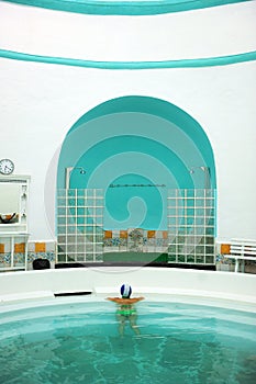 Woman inside the roman pool of the spa of Alange -Balneario- famous thermal bath in the province of Badajoz, Spain photo