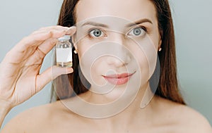 Woman insistently approves buy bottle medicine cosmetic