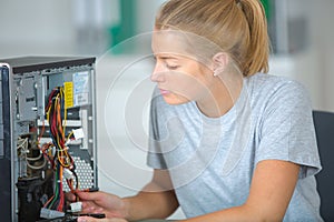 Woman inspecting the motherboard