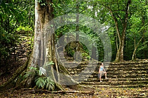 A woman inspects less studied archaeological structures in the j photo