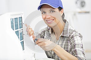 woman installing new ac system