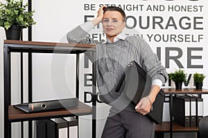 woman insurance agent with folder for papers in the office