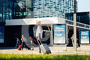 Woman at the international airport, moves to the terminal gate for travel by plane, travel concept, and aerospace industry