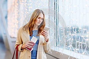 Woman at international airport waiting for flight