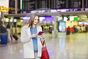 Woman at international airport waiting for flight