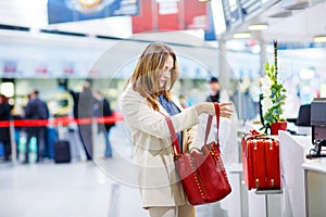 Woman at international airport waiting for flight