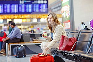 Woman at international airport waiting for flight