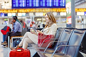 Woman at international airport waiting for flight