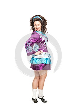 Woman in irish dance dress posing isolated