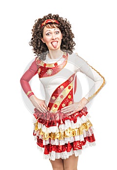 Woman in irish dance dress showing tongue