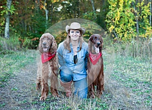 Woman with Irish Setter dogs