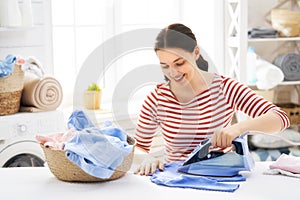 Woman is ironing at home