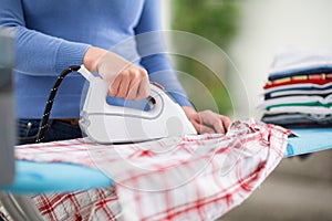 Woman from ironing services iron clothes
