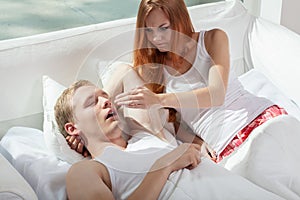 Woman irritated by snoring husband