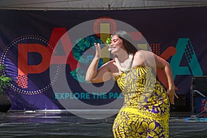 Polynesian woman and logo of Pasifika Festival, New Zealand