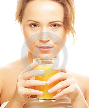 Woman isolated shot drinking orange juice